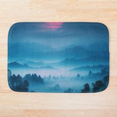 Transform your bathroom with a bath mat featuring stunning mountain views and a serene mountain aesthetic. Inspired by mountain photography and mountain art, it showcases an illustration of mountains under a blue sky. Perfect for mountain hiking enthusiasts and those who love night sky art with night sky stars and watercolor vibes. This piece adds beautiful mountain scenery to your space. Aesthetic Bath