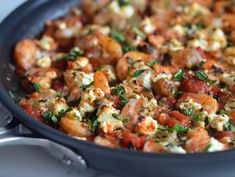 a pan filled with food sitting on top of a table