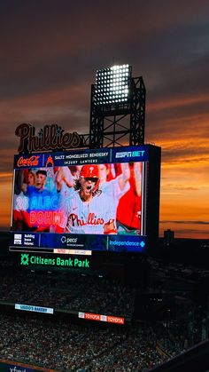 a baseball game is being played on the big screen at citizens bank park in philadelphia