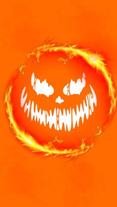 an orange background with a scary face drawn on it's side and flames coming out of its mouth