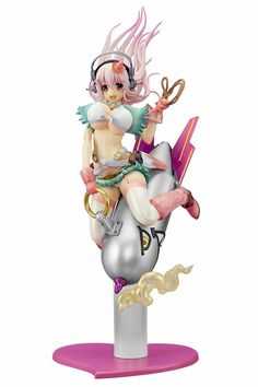 a figurine sitting on top of a metal object with pink hair and headphones