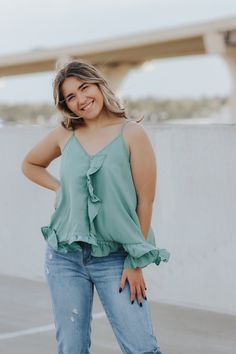 Ruffled tank top with adjustable straps. Eliza is wearing a size medium Lightweight Rayon This item is final sale. Trendy Spring Camisole With Ruffles, Green Tops With Adjustable Straps For Day Out, Spring Cami Tank Top With Adjustable Straps, Spring Brunch Tops With Tank Straps, Spring Brunch Tank Strapped Tops, Spring Brunch Tank Strap Tops, Trendy Ruffled Cami Tank Top, Casual Summer Camisole With Ruffled Straps, Spring Tank Top With Spaghetti Straps And Ruffles