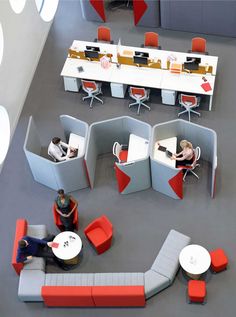 an office cubicle with people working at desks