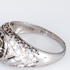 This is part of Chairish’s Fine Jewelry assortment.  Finely detailed vintage Art Deco diamond ring (circa 1920s to 1930s) crafted in 14k white gold & platinum.   Centre set old European cut diamond is estimated at 0.55 carats, accented with an estimated 0.26 carats of diamonds. The total diamond weight is estimated at 0.81 carats (estimated at I-J colour and VS2-SI2 clarity).    The stylish Art Deco era ring features a sparkling old European cut diamond to the centre, with smaller cut diamonds s Vintage Signet Ring With Diamond Accents, Vintage Formal Signet Ring With Diamond Accents, Vintage Signet Ring With Diamond Accents For Formal Events, Vintage Signet Ring With Diamond Accents For Formal Occasions, Antique Signet Ring With Diamond Accents For Formal, Antique Signet Ring With Diamond Accents For Formal Occasions, Classic Diamond Signet Ring Collectible, Vintage White Gold Signet Ring With Center Stone, Collectible Classic Diamond Signet Ring