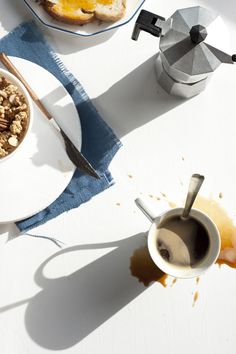 breakfast food and coffee on a white table