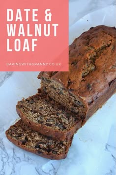 a loaf of date and walnut loaf sitting on top of a white paper towel next to a sliced loaf of banana bread