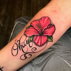 a woman's arm with a flower and the word ann written in cursive writing