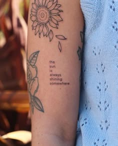 a woman's arm with a tattoo saying the sunflower is always coming somewhere