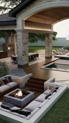 an outdoor living area with couches, fire pit and pool in the back yard