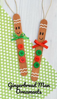 gingerbread man ornament made out of popsicles with buttons on them