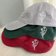 Enjoy this Dad Hat-- the perfect Dad Hat, with a simple yet sweet floral design.  Your choice of color!  Back: adjustable metal buckle closure. Beautifully stitched with a white floral design on the side.  Any questions? Just ask! Cheap Spring Dad Hat With Embroidered Logo, White Floral Design, Sweet Floral, Dad Hat, Metal Buckles, Trucker Cap, You Choose, Carbon Emissions, Dad Hats