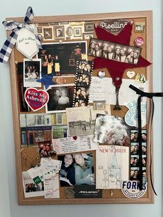 a bulletin board covered in pictures and magnets