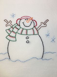 a snowman embroidered onto a white shirt