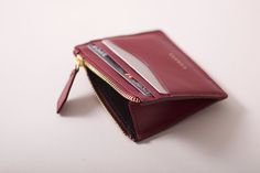 This slim card holder serves as everyday minimalist wallet and expandable top zipped coin pouch.  Just in time for the holidays, and to make this time of the year more enjoyable and less stressful, Cerana offers gift wrapping service upon request at a small extra cost of £ 3.50. We welcome requests for custom orders, corporate orders and commissions, please contact us with any requirement you may have in mind. W H A T F I T S? Up to 10 cards, small earbuds, coins, tickets or folded bills D I M E N S I O N S W 9.5 cm x H 7.5 cm x D 0.5 cm / 3.8'' x 2.9'' x 0.2'' M A T E R I A L S Exterior - 100% Full Grain environmentally certified cowhide Spanish hides Interior - 100% soft cotton twill lining made in Portugal. YKK anti-scratch polished gold tone hardware  M A I N   F E A T U R E S Made in Minimalist Everyday Wallet With Zipper Closure, Modern Card Holder With Zipper Closure As Gift, Elegant Everyday Card Holder With Zipper, Small Wallets For Women, Personalized Leather Wallet, School Food, Wallet Gifts, Wallet Pouch, Minimalist Wallet