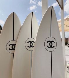 three surfboards are lined up next to each other