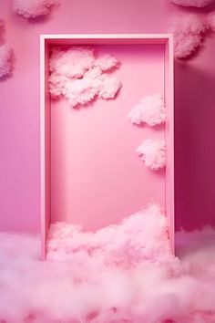 an empty pink door surrounded by fluffy white clouds in a room with pink walls and flooring