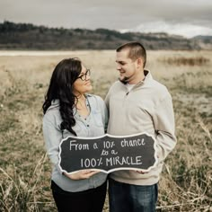 a man and woman holding a sign that says from a to z chance as a marriage