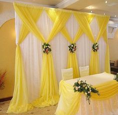 a banquet room decorated in yellow and white