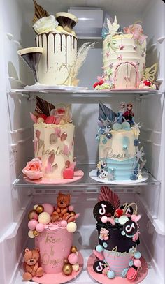 a refrigerator filled with lots of different types of cakes