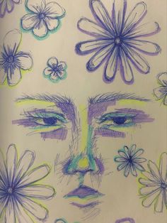 a drawing of a woman's face surrounded by flowers