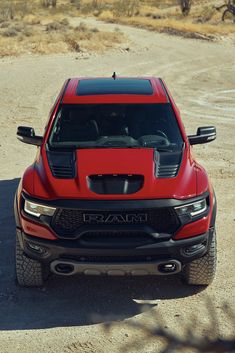 the front end of a red ram truck