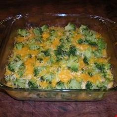 a casserole dish with broccoli and cheese in it on a table