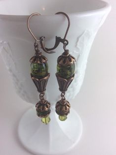 Check out this item in my Etsy shop https://www.etsy.com/listing/732551170/copper-and-green-lever-back-earrings Green Copper Drop Earrings, Green Czech Glass Drop Earrings, Nickel-free Brown Earrings With Czech Glass, Nickel-free Brown Czech Glass Beaded Earrings, Green Wire-wrapped Czech Glass Earrings, Fabric Bracelets, Assemblage Necklace, Green Earrings, Gorgeous Bracelet