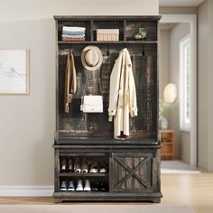 an old wooden coat rack with shoes and coats hanging on it