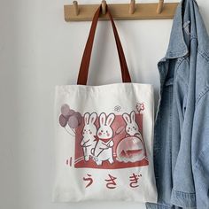 These kawaii rabbit tote bags not only cute but also practical. Well-made. with canvas material. and a vibrant design! Large capacity. can store books. stationery. water glasses. umbrellas. clothes and some personal belongings. Suitable for students. Harajuku. kawaii. casual .office and other styles. Size : wide:34cm height:39cm Three Rabbits, Duck Tote, Kawaii Casual, Kawaii Rabbit, Kawaii Bunny, Hello Kitty My Melody, Folding Umbrella, Cloth Bag, Pocket Pattern