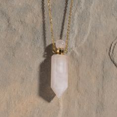 Discover Your Crystal Perfume Amulet Necklaceand stay empowered with your magic. Unleash your inner alchemist with our stunning Crystal Perfume Amulet Necklace, available in Rose Quartz, Amethyst, Amazonite, Smoky Quartz, and Clear Quartz. Each hand-carved natural crystal is paired with an 18K gold-plated, adjustable 21" chain to create a one-of-a-kind, enchanting accessory. Elevate your scent game by filling the crystal with up to 1ml of ASCENTION Perfume using the included dropper. Mix and mat Spiritual Crystal Necklace With Round Pendant, Spiritual Crystal Necklace With Round Pendant And Adjustable Chain, Spiritual Rose Quartz Round Pendant Necklace, Rose Gold Quartz, Amethyst Gold, Quartz Colors, Amulet Necklace, Smoky Quartz Crystal, Smokey Quartz