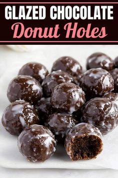 glazed chocolate donut holes on a plate with text overlay that reads glazed chocolate donut holes