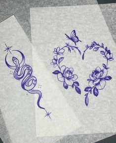 two pieces of paper with designs on them sitting next to each other, one has a butterfly and the other has flowers