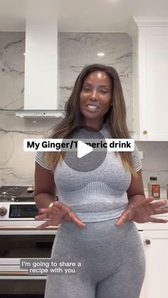 a woman standing in a kitchen with her hands out to the side and texting that reads, my ginger / verite drink i'm