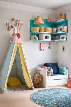 a child's room with a teepee tent and shelves