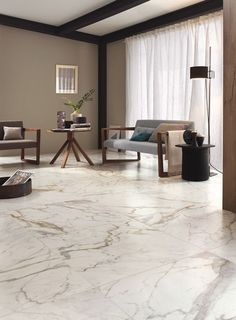 a living room with marble flooring and furniture