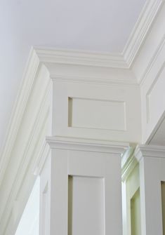 the corner of a room with white walls and trim