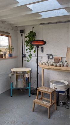 a room filled with lots of pots and furniture