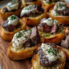 small pieces of bread with meat and cheese on them