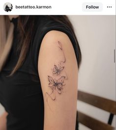 a woman with a flower tattoo on her arm