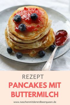 pancakes with blueberries and syrup on a plate