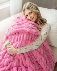 Young woman sitting with her knees pulled up covered in a hot pink ruched plush blanket. Bean Bag Living Room, Decor Organization, Elite Daily, Best Hug, Fluffy Blankets, Pink Blanket, Tech Products, Packing Lists, Organization And Storage