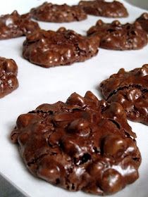 chocolate cookies are arranged on a baking sheet