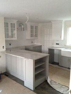 the kitchen is being remodeled with all white cabinets