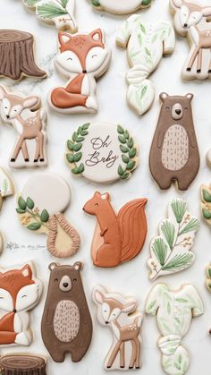 cookies decorated with different types of animals and trees