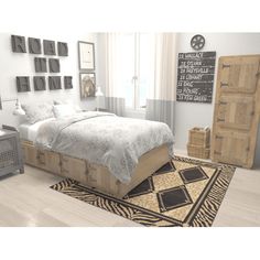 a large bed sitting on top of a wooden floor next to a dresser and chair