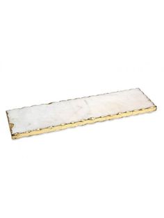 a white marble and gold plate on a white background, with the edge cut out to look like a rectangle