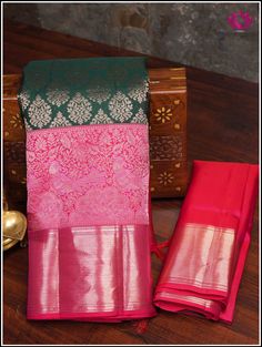 A Kanchipuram silk saree in an enchanting green hue highlights an ornate floral motifs on the body. The contrasting pinkish-red pallu showcases brocade designs, margined by lively parrot and peacock along with floral patterns provide a sense of natural beauty. The lush green shade represents freshness and vitality, while the intricate patterns add an element of traditional opulence. This saree incorporates bold pinkish-red double border. The cross striped border at the bottom complements the abo Red Tissue Silk Traditional Wear With Pallu, Red Tissue Silk Saree For Traditional Ceremonies, Brocade Designs, Pinkish Red, Kanchipuram Silk Saree, Rich Fabric, Silk Brocade, Pure Silk Sarees, Floral Motifs