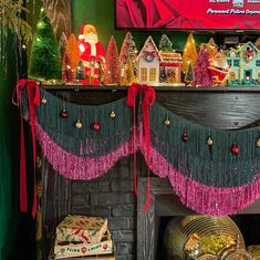 a fireplace decorated with christmas decorations and ornaments