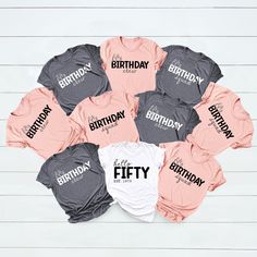 a bunch of shirts that say happy birthday and fifty with the number one on them