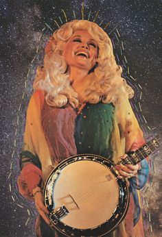 a woman with blonde hair holding a white and black instrument in front of a star filled sky